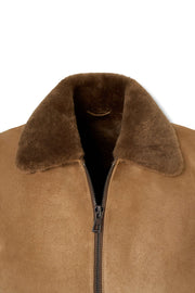 Men's camel shearling suede bomber jacket with full zipper and flap pockets styled for casual wear