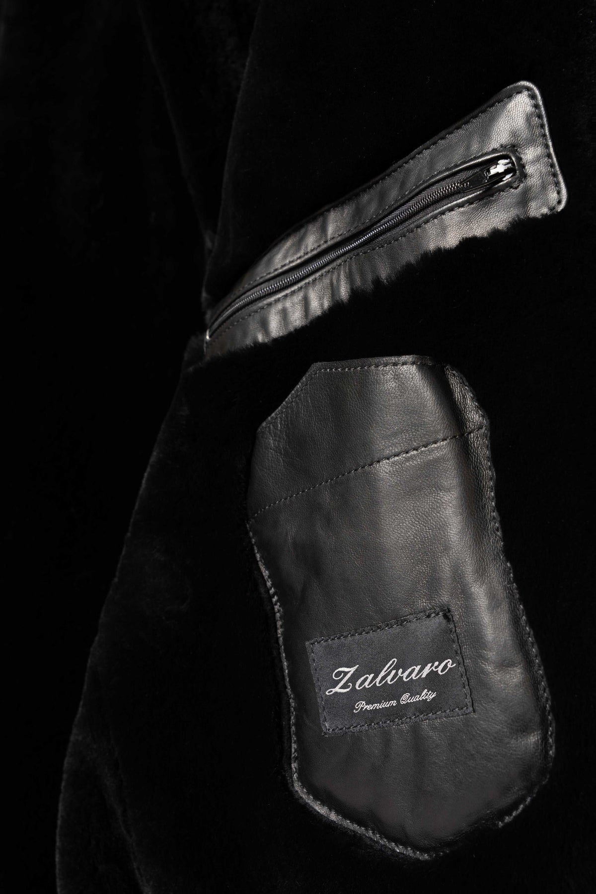 Arctic hooded leather bomber jacket in black with shearling lining for warmth and elegance