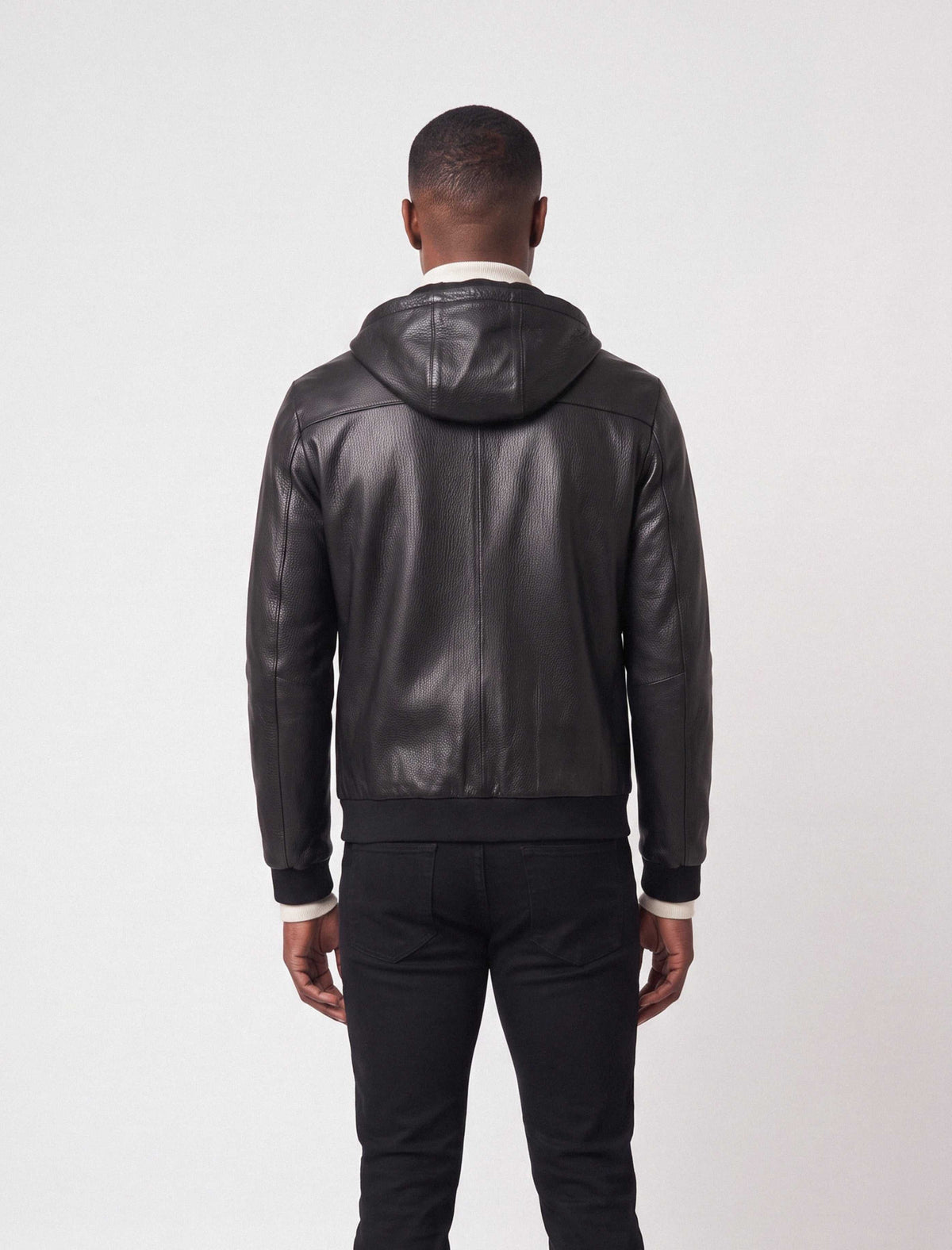Lorcan Men’s genuine black leather hooded jacket with adjustable hood and zip pockets