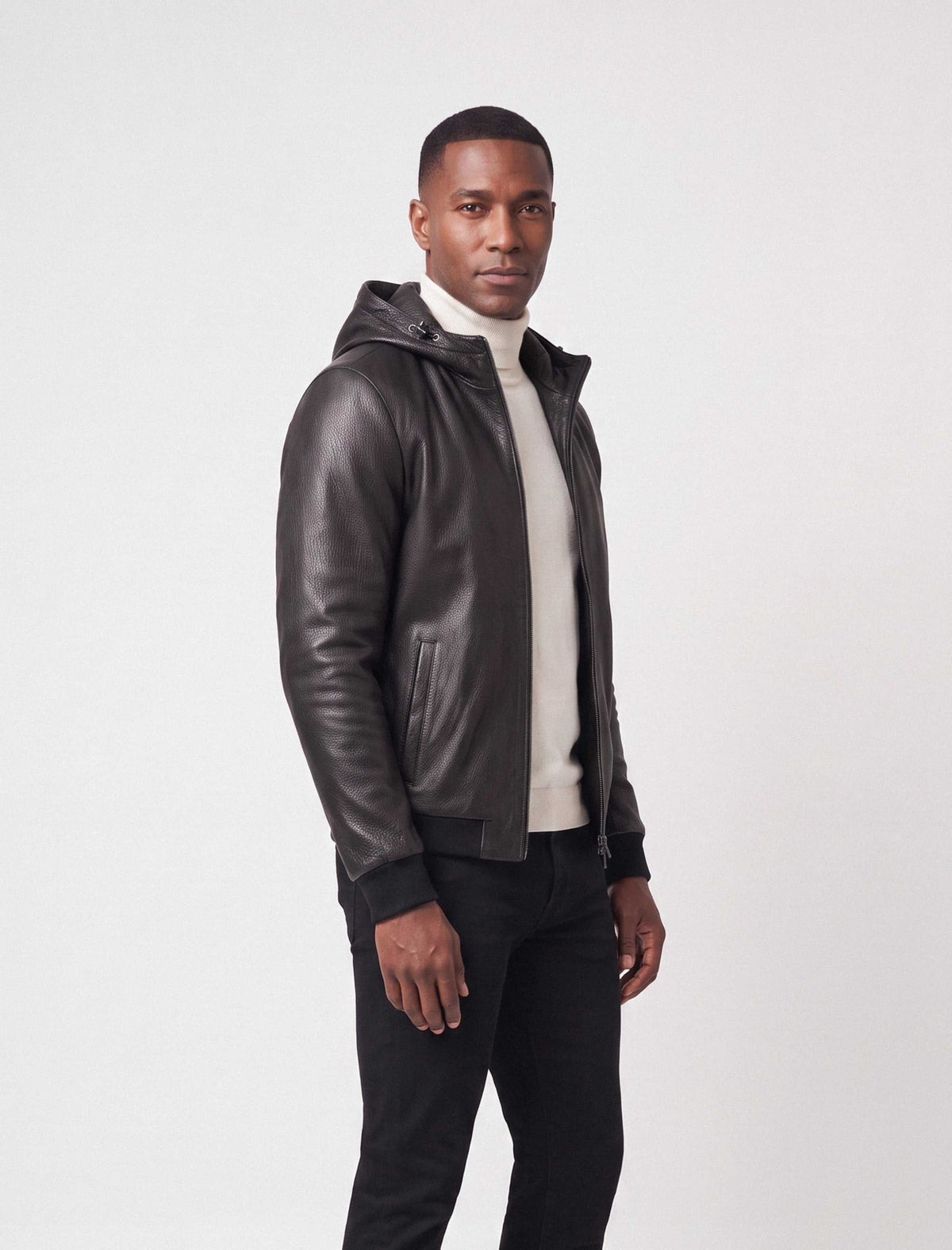 Lorcan Men’s genuine black leather hooded jacket with ribbed trims and zip pockets