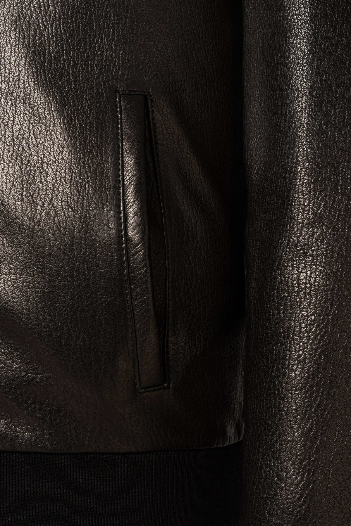 Lorcan Men’s genuine black leather hooded jacket with ribbed trims and zip pockets