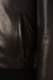 Lorcan Men’s genuine black leather hooded jacket with ribbed trims and zip pockets