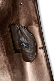 Man wearing Aspen Brown Shearling Coat with oversized lapel and double-breasted front outdoors
