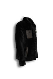 Black premium shearling leather jacket with refined pocket details and modern tailoring