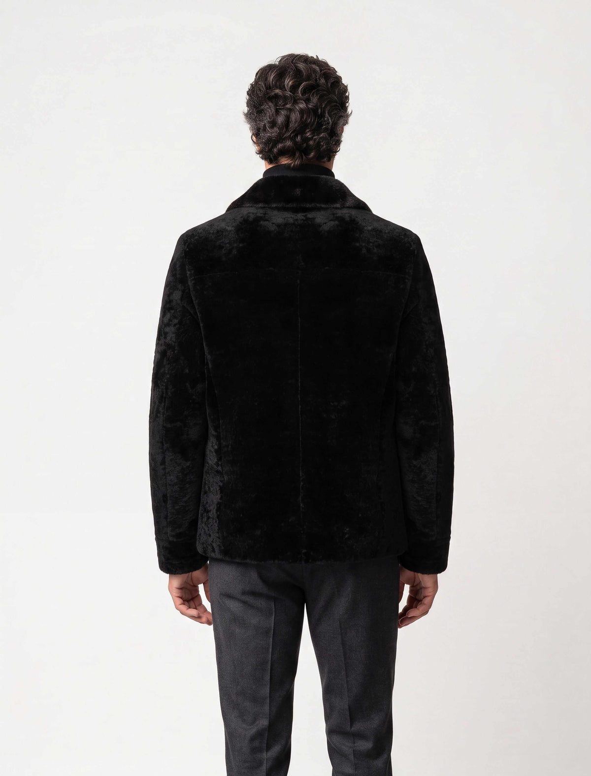 Black Premium Shearling leather jacket with detailed leather pockets and modern tailoring