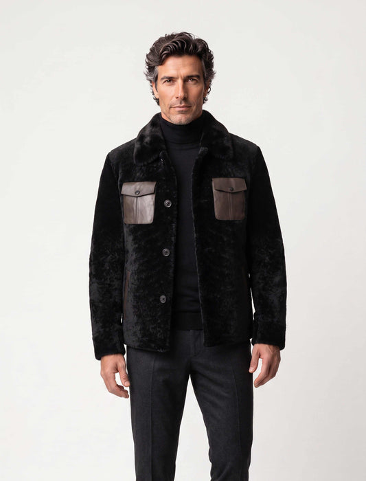 Black premium shearling jacket with leather pockets and modern tailoring