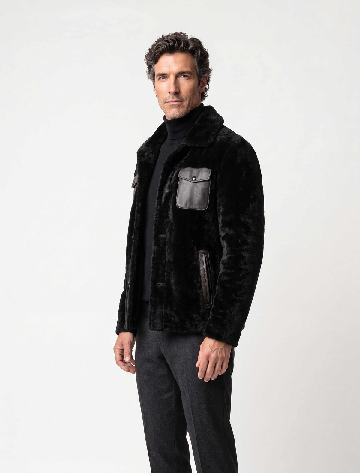 Black premium shearling jacket with leather pockets and modern tailoring