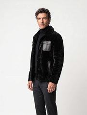 Black premium shearling jacket with leather pockets and modern tailoring
