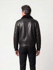 Black shearling leather bomber jacket with curly lamb collar and military-inspired design