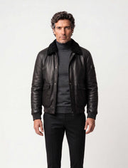 Black shearling leather bomber jacket with curly lamb collar and military-inspired design