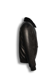 Black shearling leather bomber jacket with curly lamb collar and military-inspired design.