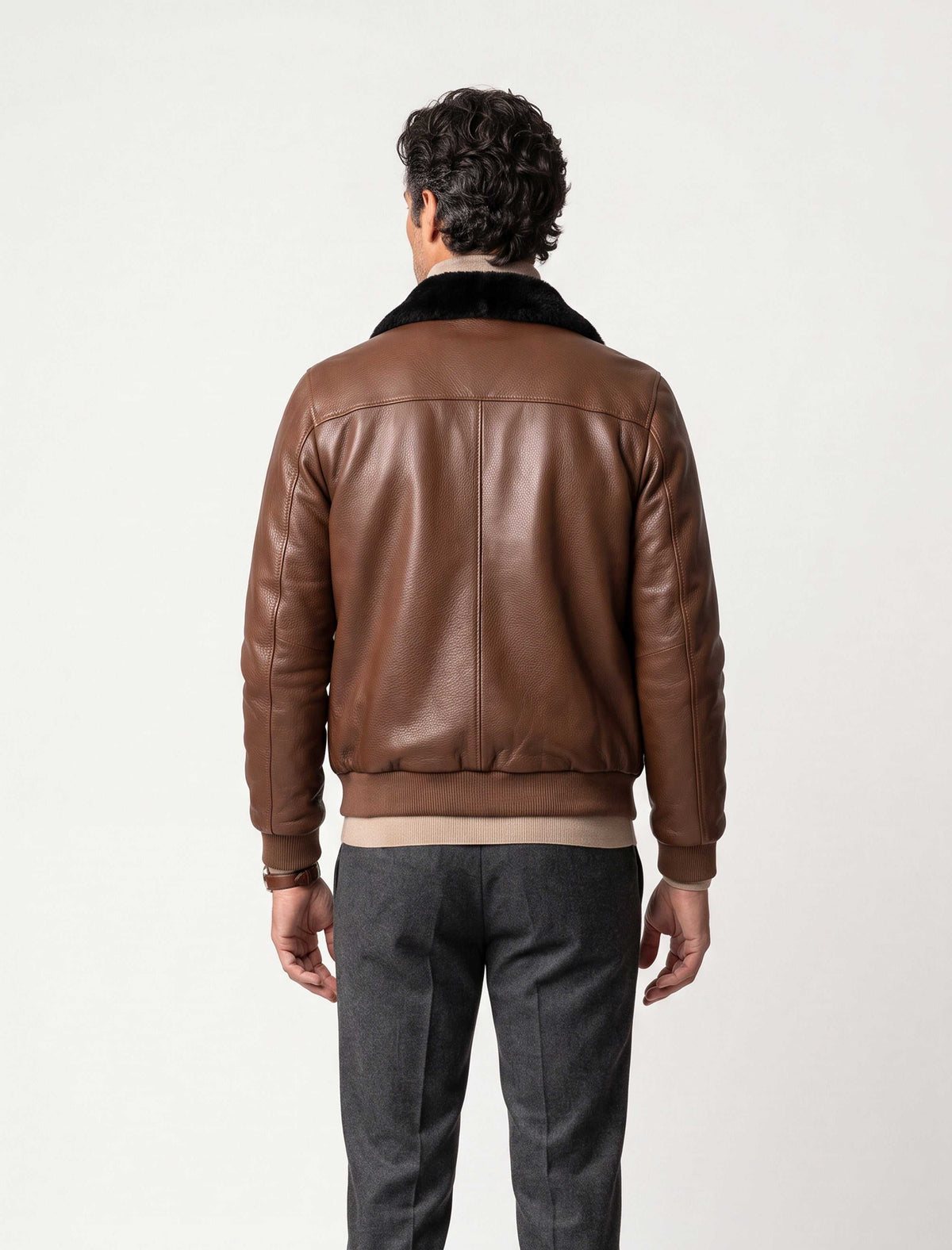 Men's brown leather bomber jacket with black mink fur collar on a male model