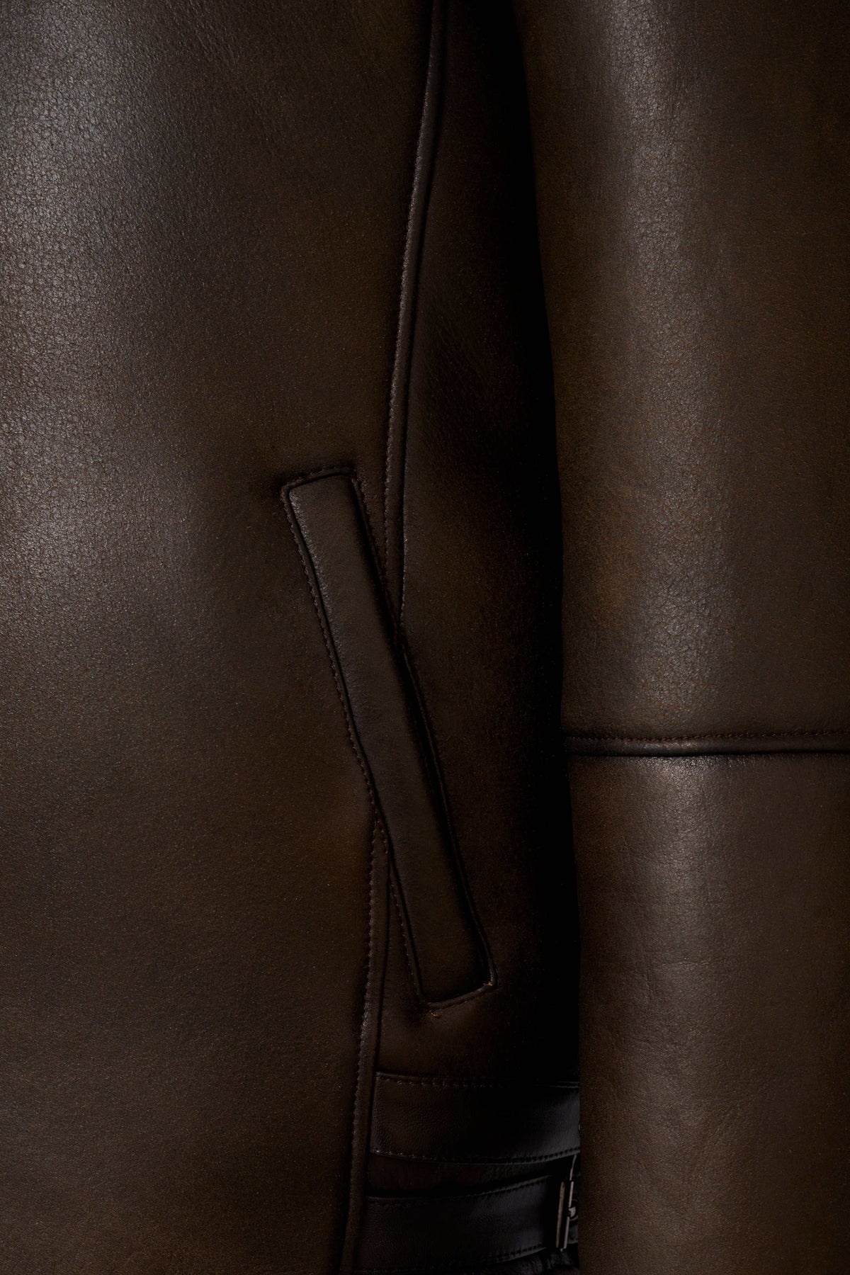 Dark brown hooded shearling leather jacket with genuine sheepskin and natural shearling interior for winter warmth