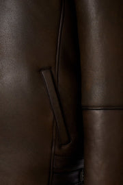 Dark brown hooded shearling leather jacket with genuine sheepskin and natural shearling interior for winter warmth