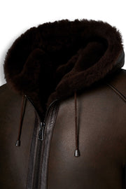 Dark brown hooded shearling leather jacket with natural shearling interior for winter warmth