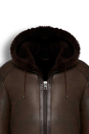 Dark brown hooded shearling leather jacket with natural shearling interior for winter warmth