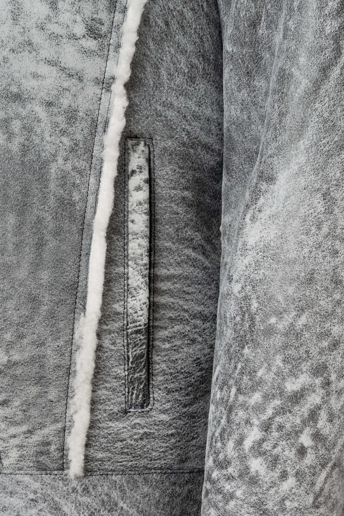 Men's grey shearling leather trucker jacket with white wool collar and premium natural shearling lining