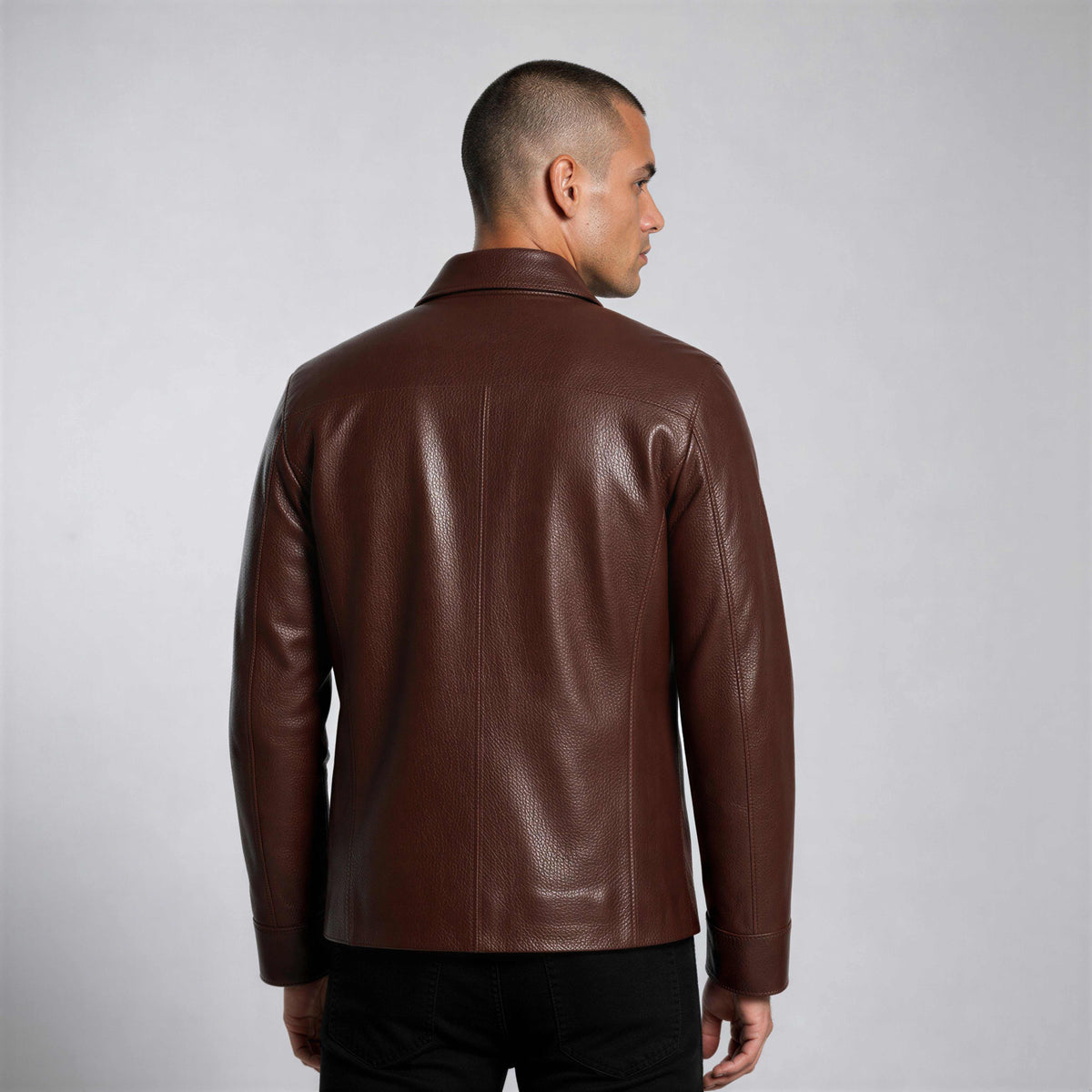 Man wearing Hudson Leather Overshirt in rich brown full-grain leather with flap chest pockets and tailored fit