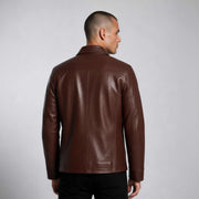 Man wearing Hudson Leather Overshirt in rich brown full-grain leather with flap chest pockets and tailored fit