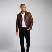 Men's Hudson Leather Overshirt in rich brown genuine leather with chest and hand pockets, showcasing craftsmanship and timeless style