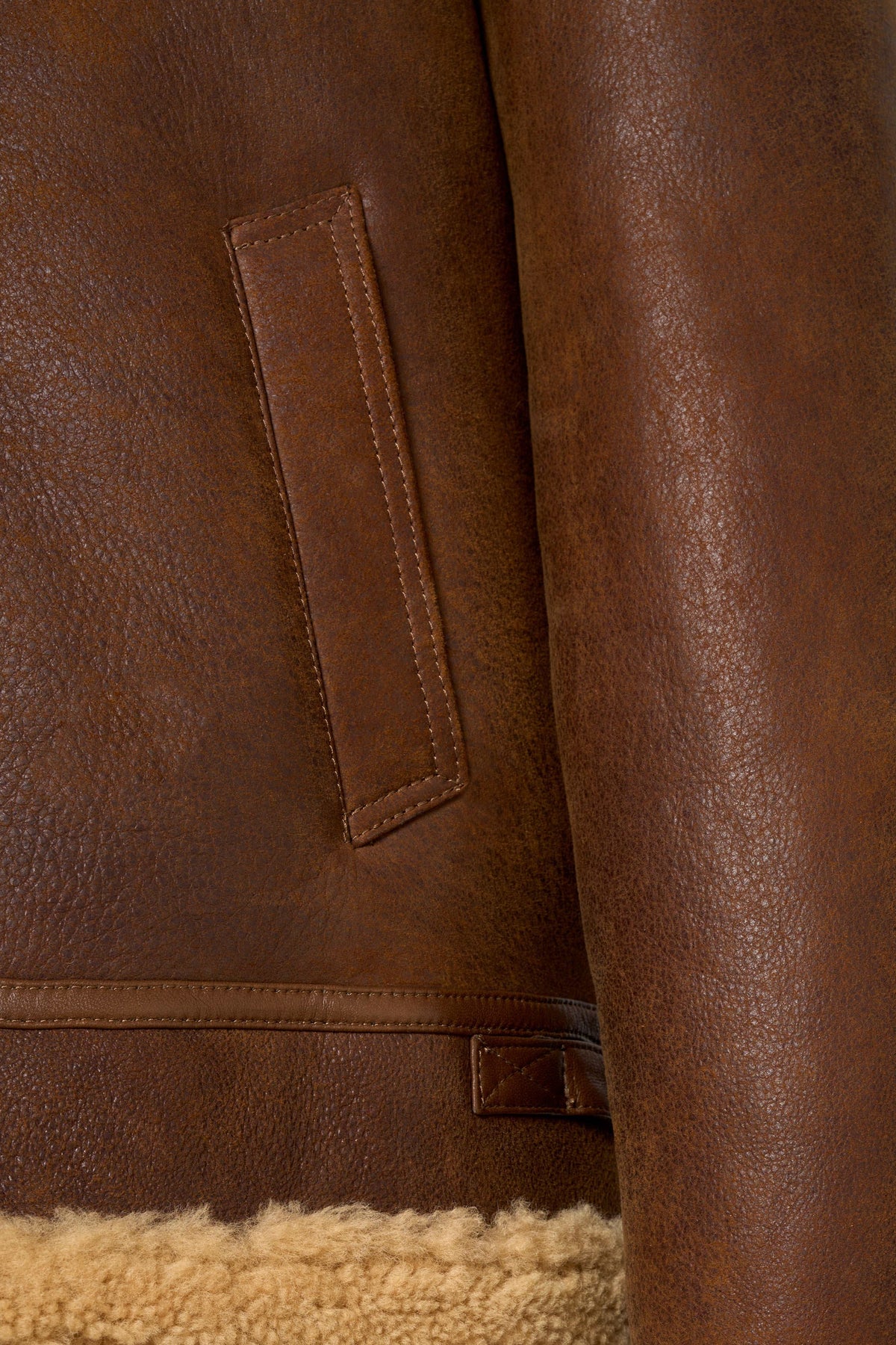 Tan genuine shearling leather aviator jacket with soft shearling lining and classic B-3 flight design
