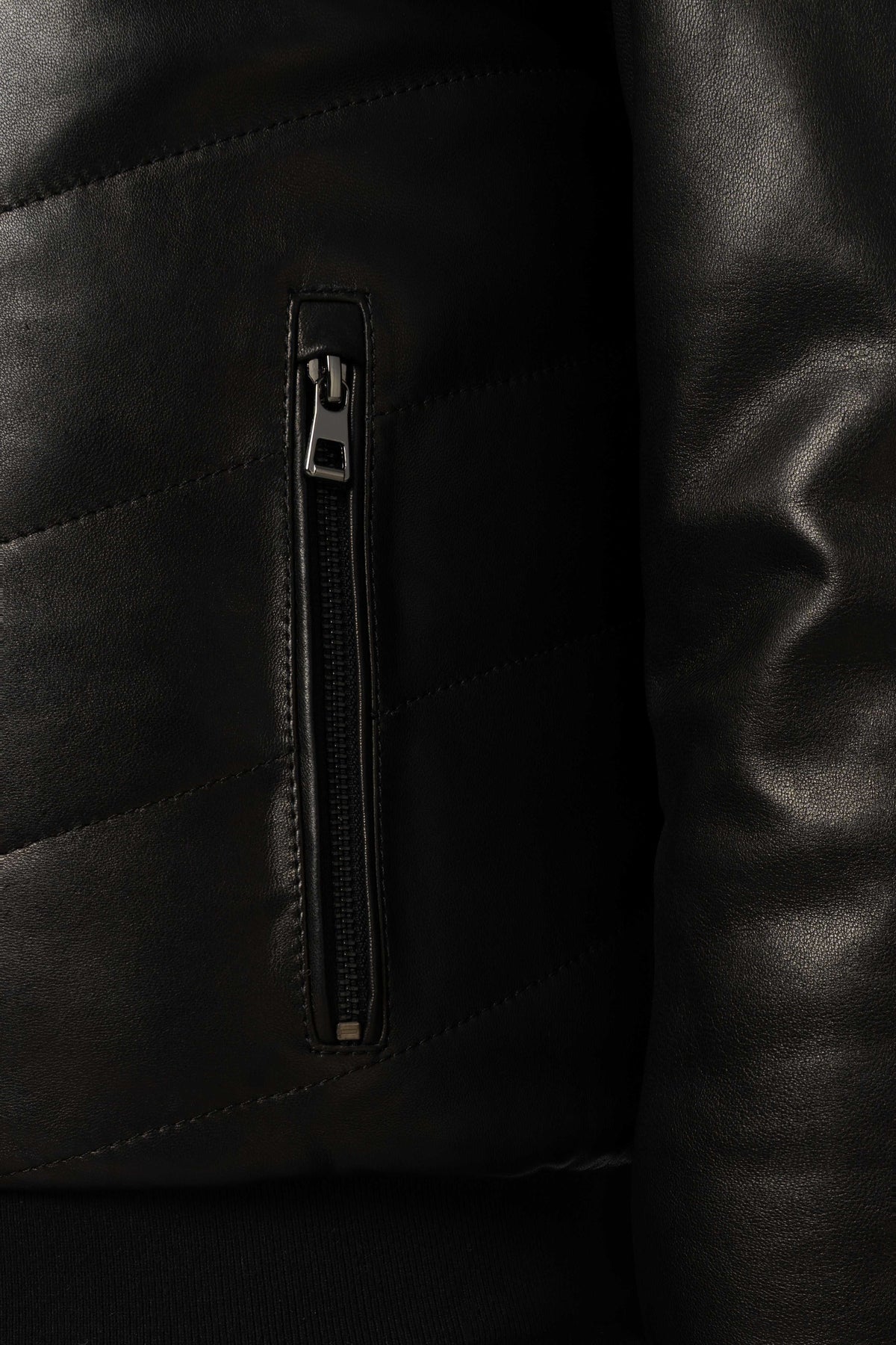 Noir Quilted Shearling Leather Bomber jacket with tailored fit, shearling collar, and premium lamb leather craftsmanship