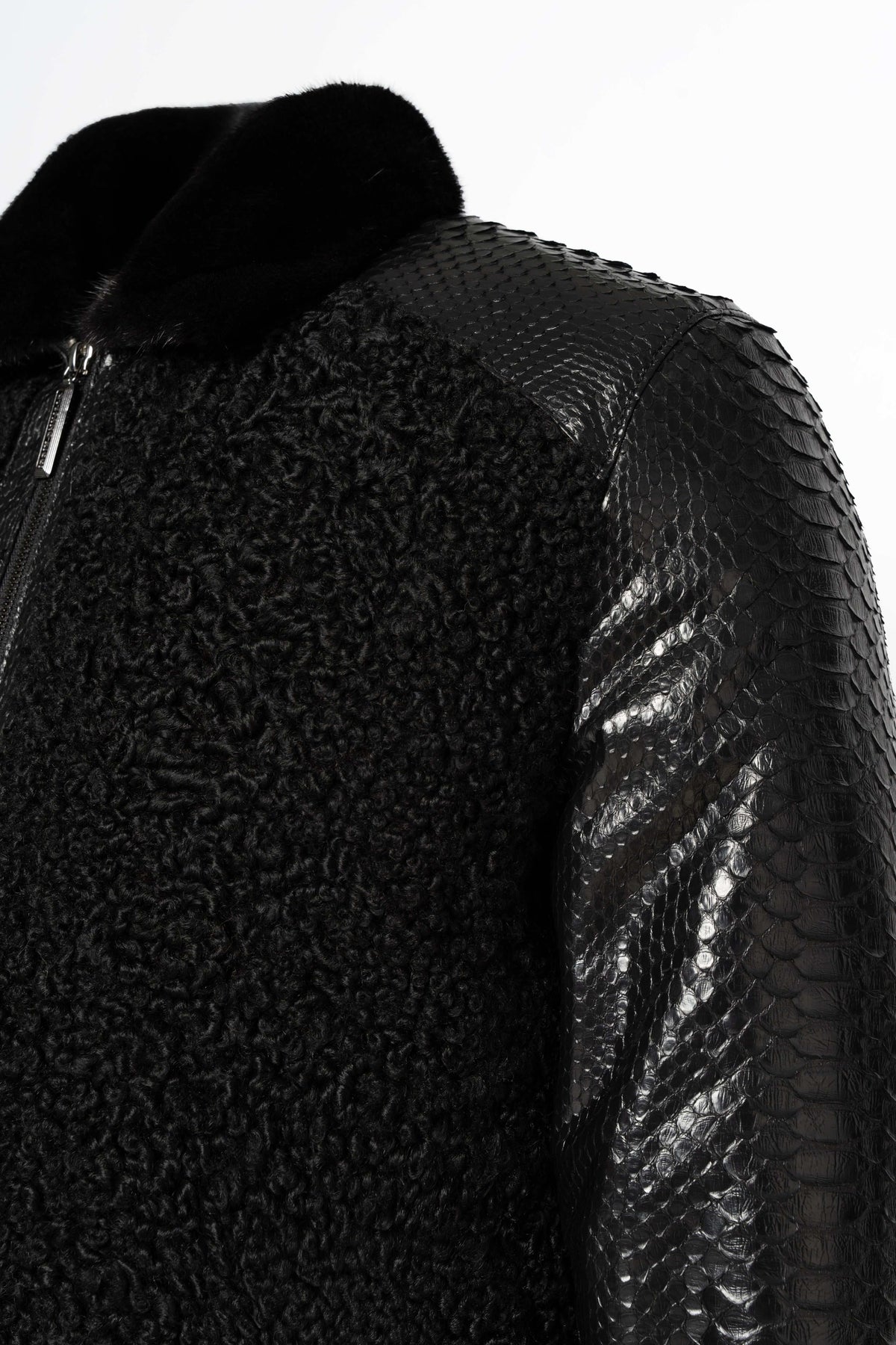 Noir Python & Astrakhan Leather Bomber Jacket with mink collar on mannequin showcasing luxury craftsmanship