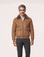 Men's camel shearling suede bomber jacket with full zipper and flap pockets on a mannequin