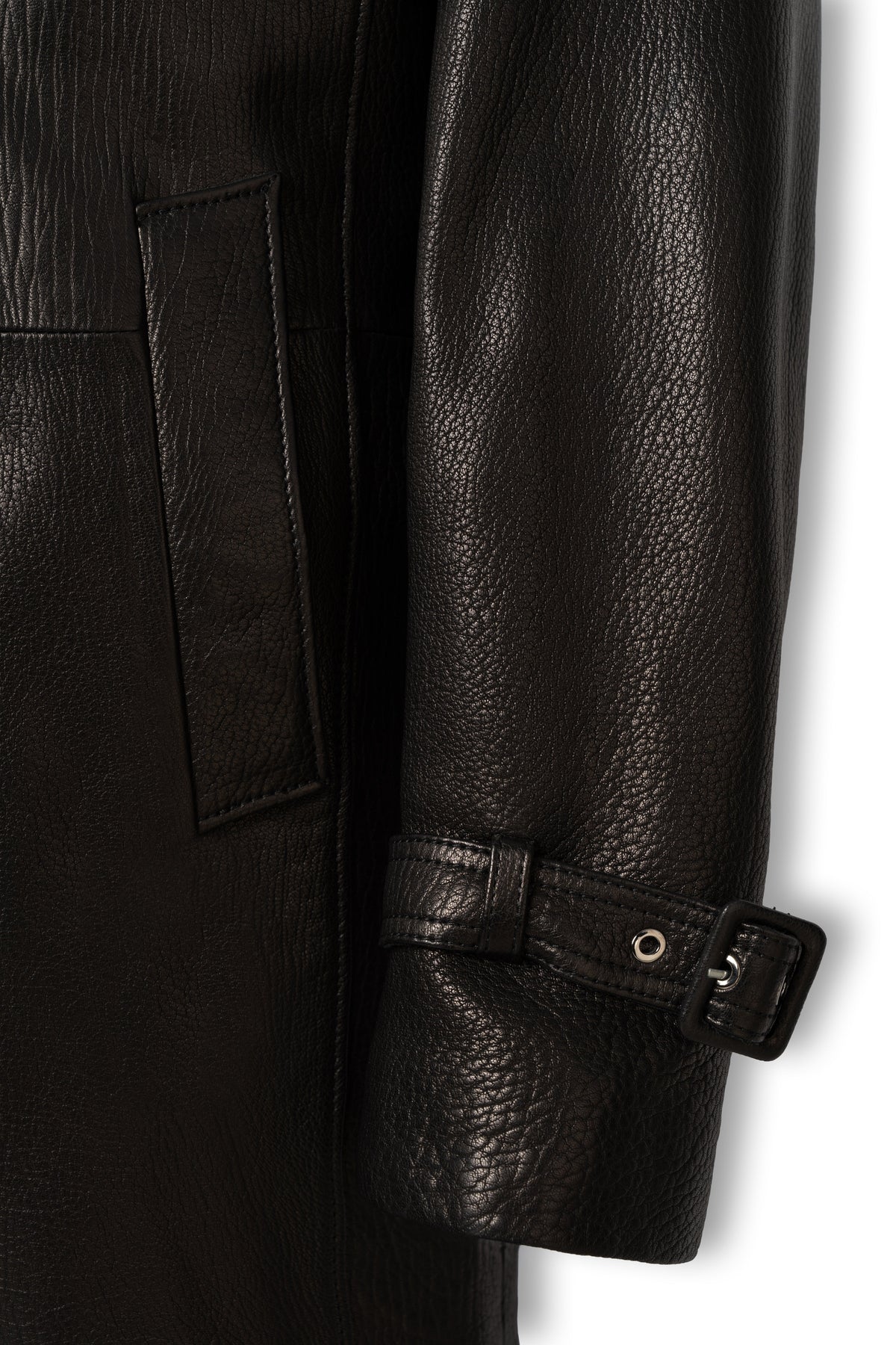 Leather buckle cuff strap and welt pocket detail on Valmont trench coat