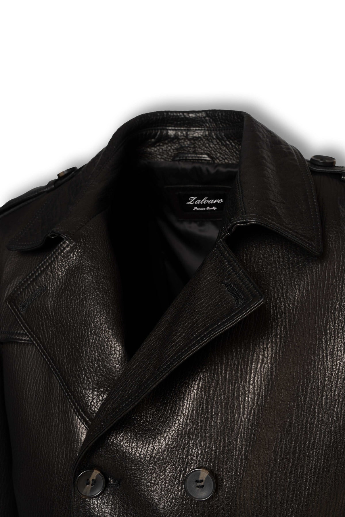 Close-up of wide leather lapels and double-breasted construction on Valmont trench coat
