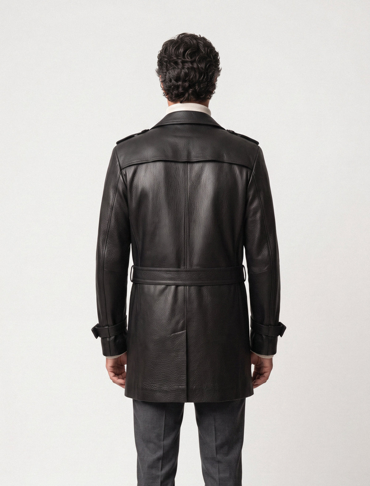 Man wearing Valmont black eather trench coat back view