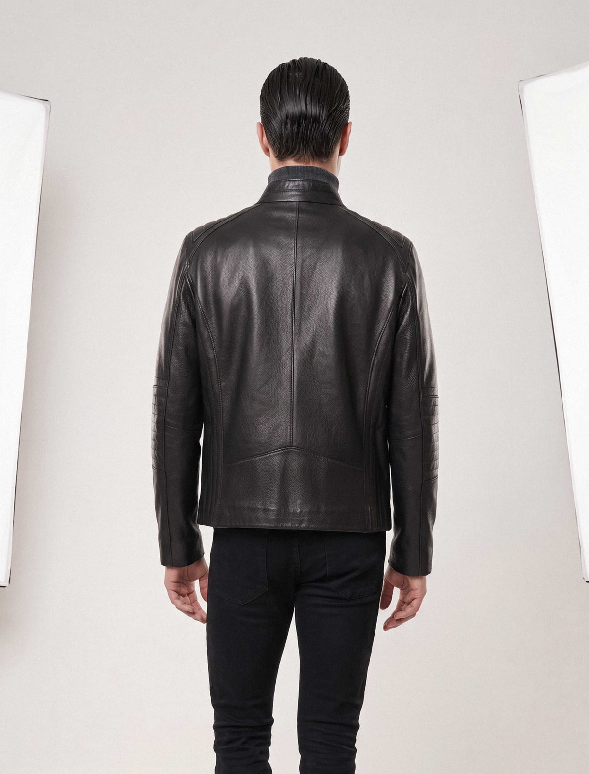 Varenn Men’s genuine leather racer jacket in black with quilted shoulders and stand collar