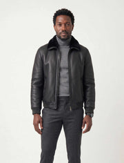 Noir shearling leather bomber jacket with shearling collar and premium metal hardware