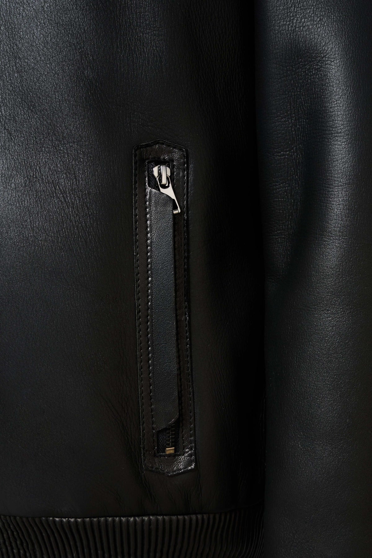 Noir Shearling Leather Bomber Jacket with shearling collar and premium leather craftsmanship