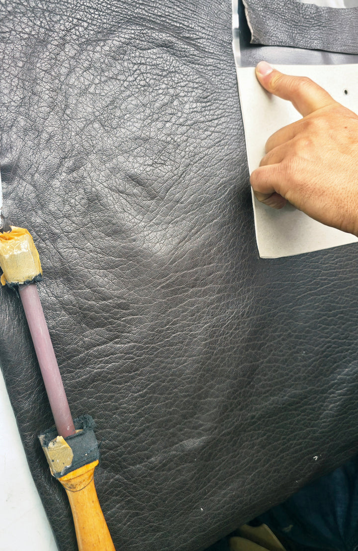 Zalvaro artisan marking a genuine leather hide by hand