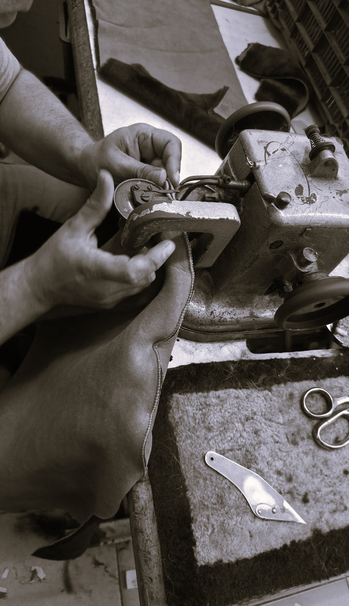 Hand-finished genuine leather seam detail at the Zalvaro workshop